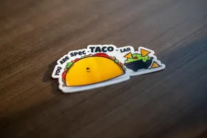 The Ally Co. brand photo containing sticker,taco